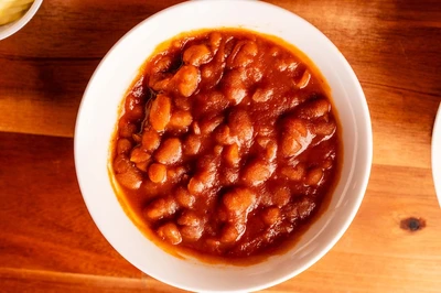 Buddy's catering includes sides like baked beans