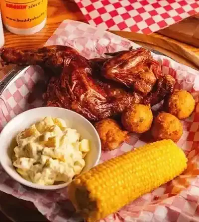 half of a chicken from Buddy's with corn